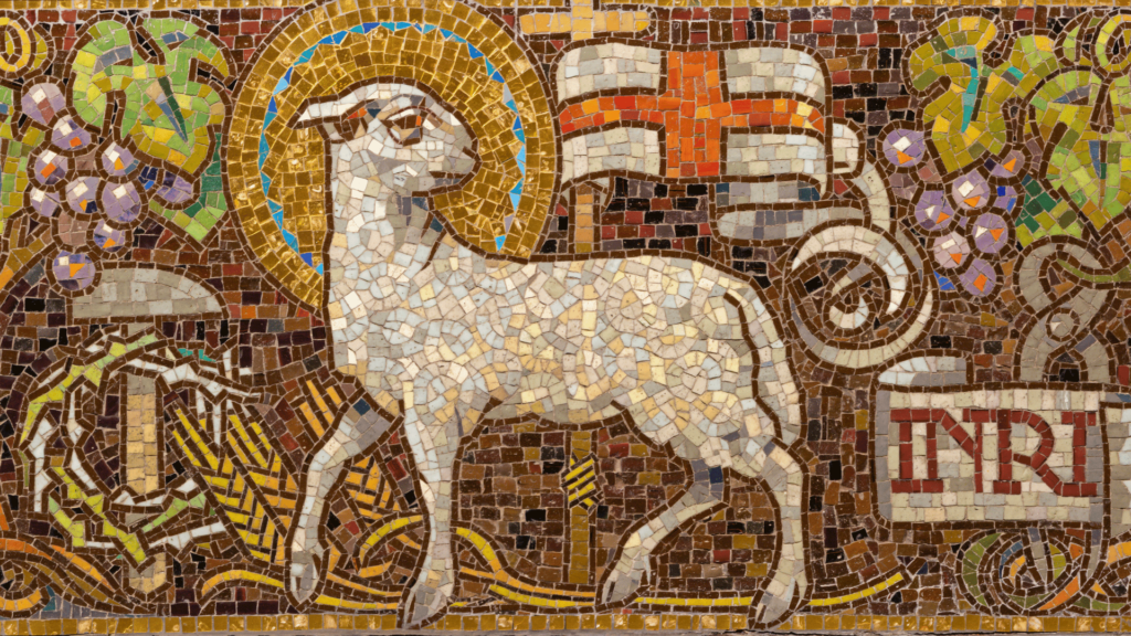 Stained glass window depicting the Lamb of God with a halo and a banner.

